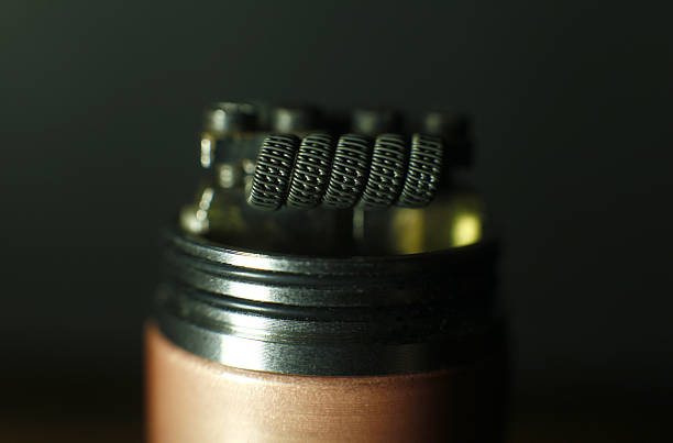 istock Triple fused clapton coil build in vaping rebuildable dripping atomizer 637684536