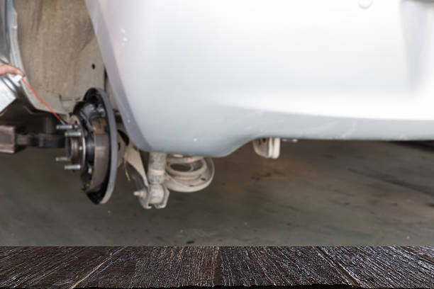istock mechanic spray chemical to clean brake (blur image 637685588