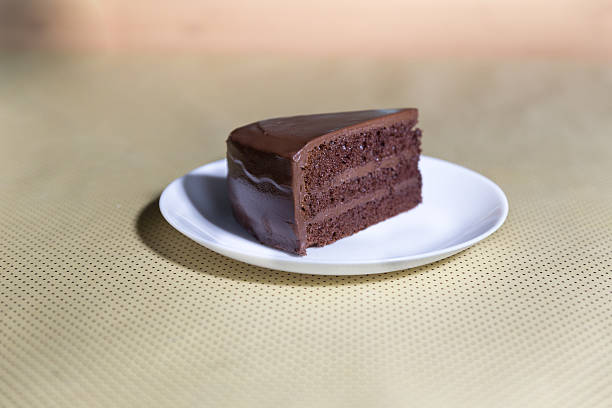istock Delicious dark chocolate cake in white plate 637686308