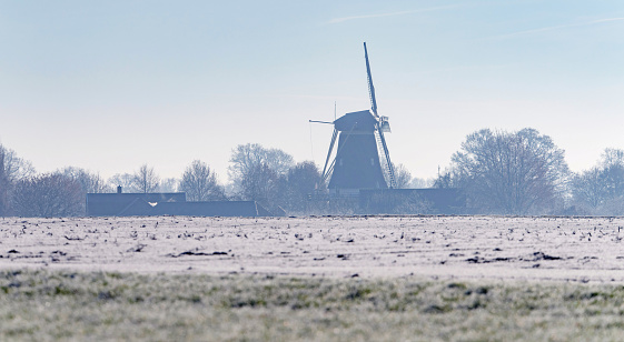 Dutch windmill in rural landscape in winter. Geesteren. Achterhoek. Gelderland. The Netherlands.