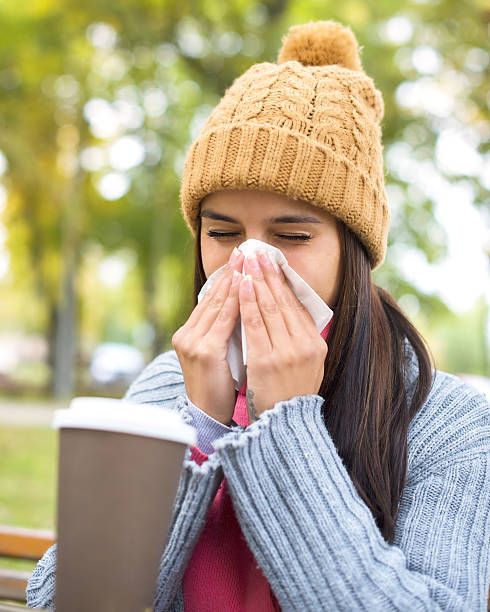 istock Women with tissue having flu or allergy 637694312