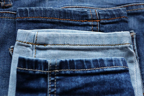 istock Blue denim jeans texture and background with seams 637695134