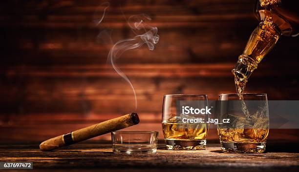 Glasses Of Whiskey With Ice Cubes Served On Wood Stock Photo - Download Image Now - Cigar, Whiskey, Bar - Drink Establishment