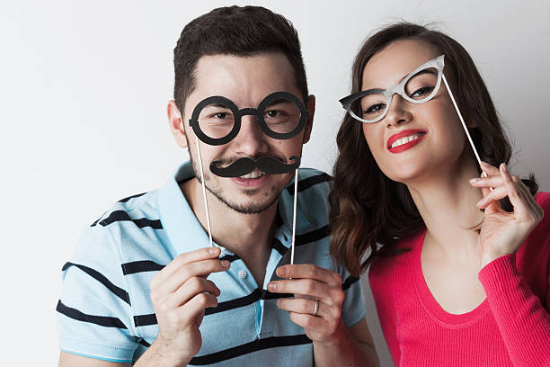 istock Couple with party glasses and mustaches 637699696