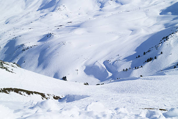 istock Alpine valley with ski, snowboard slopes, off piste 637701480