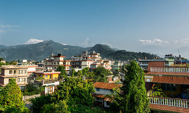 istock Rooftop view of mountains rising in distance. 637702376