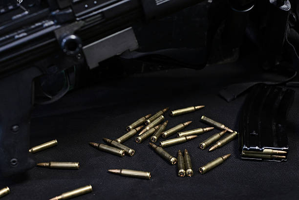 istock ammo to machine gun in the cage 637704256