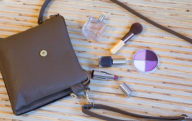 istock Open leather bag with women cosmetics 637704364