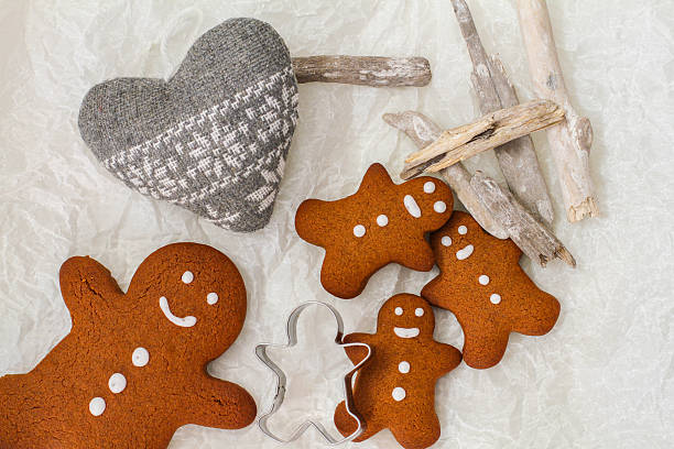 istock Four gingerbread man cookies on the table 637704978