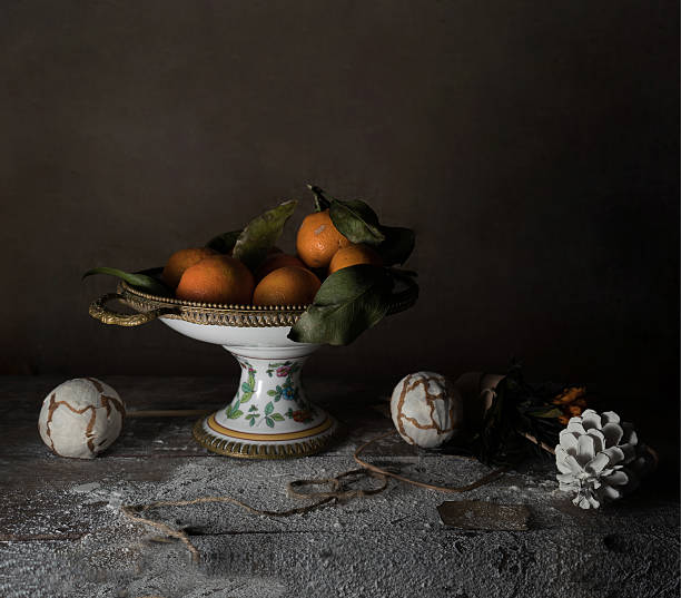 istock still life, vintage. Vase with tangerines, scarf, decor on a 637706664