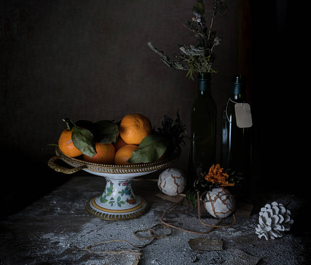 still life, vintage. Vase with tangerines, scarf, decor on a