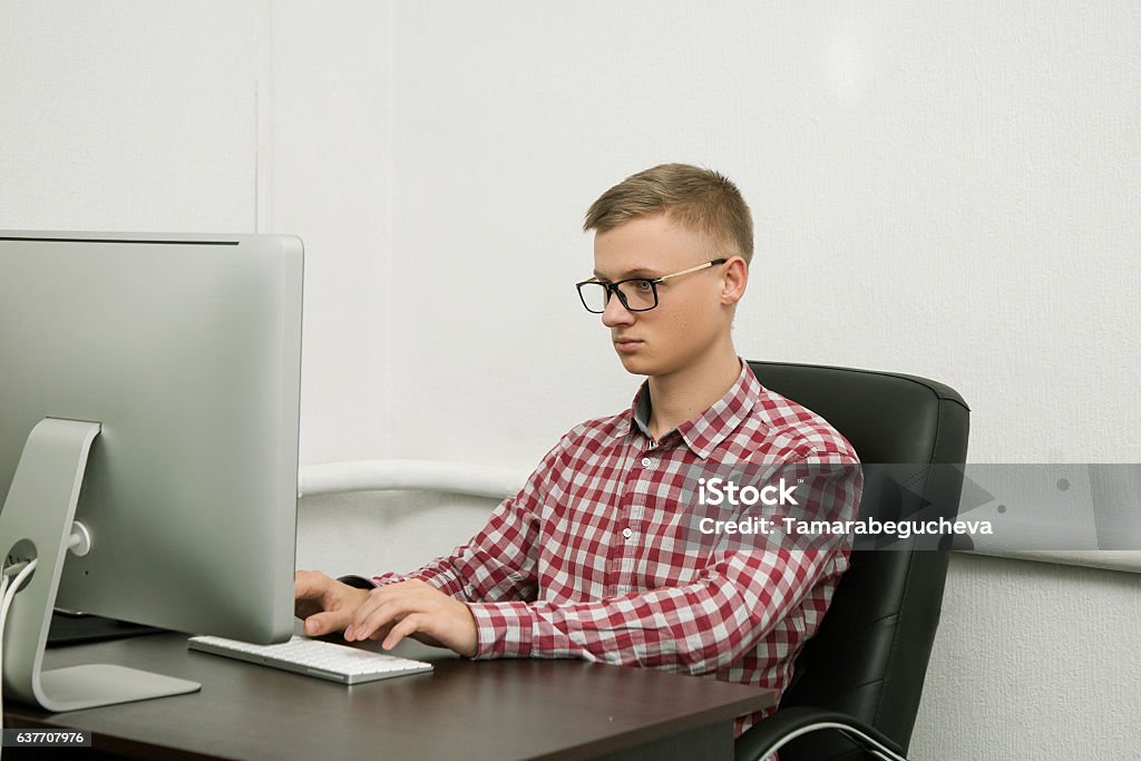 At The Computer Man At The Computer Stock Photo - Download Image Now - Adult, Blue ...