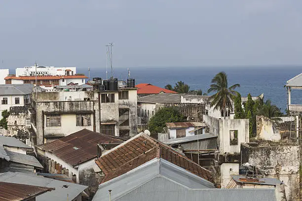 rooftop view over the african city of stonetown zanzibar showing the weathered zinc roofing and city skyline