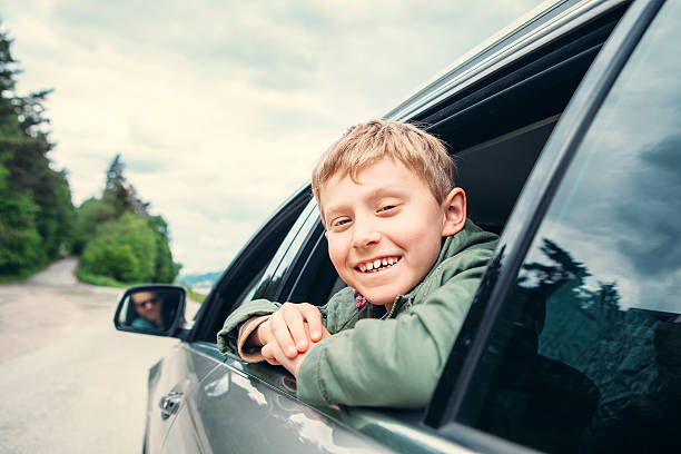 istock Happy boy travel with father in auto 637710230