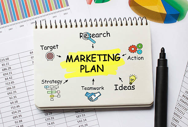 istock Notebook with Toolls and Notes about Marketing Plan 637711134