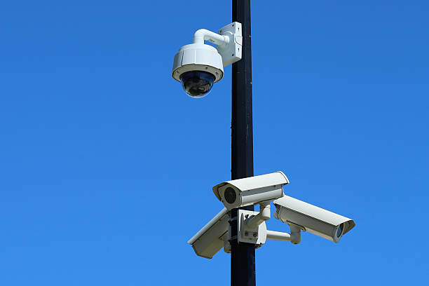 Security Cameras with Blue Sky Set of security Cameras, CCTV, with Blue Sky home recording studio setup stock pictures, royalty-free photos & images
