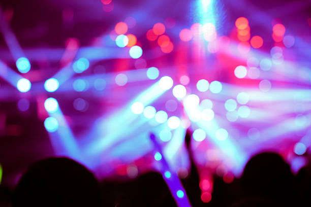 Defocused entertainment concert lighting on stage, blurred disco party and Concert Live.