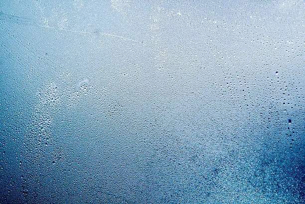 Close-up of water drops on a window, Natural water drops on glass, winter condensation