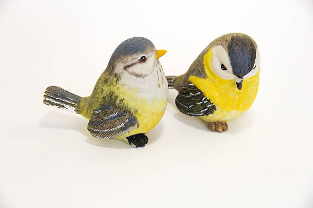 Two toy birds next to each other Two toy birds next to each other dearness stock pictures, royalty-free photos & images