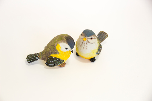 Two toy birds next to each other