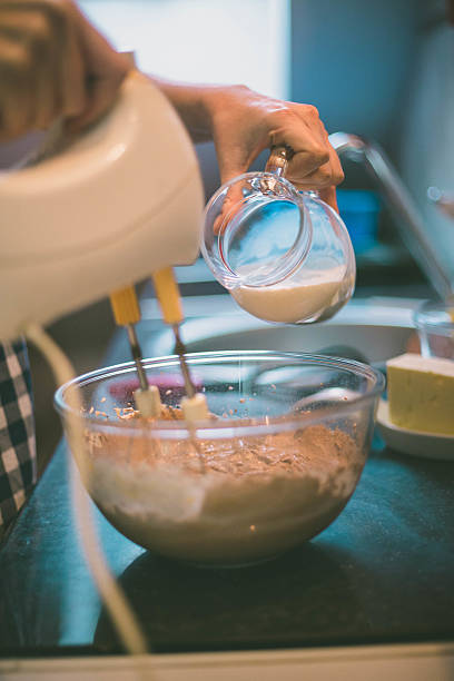istock happy woman cooking on kitchen 637716544