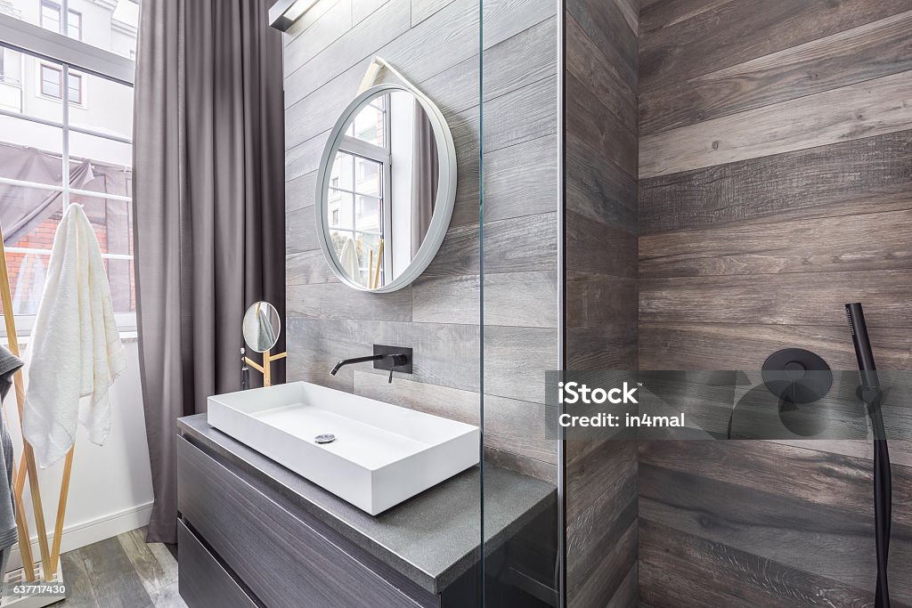 Bathroom with shower and basin Bathroom with walk in shower and white countertop basin Tile Stock Photo