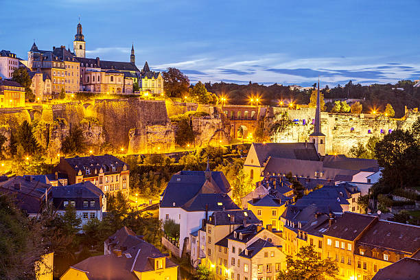 Night view of Luxembourg City Night view of Grund and St John's Church from Ville Haute, Luxembourg City grunt fish photos stock pictures, royalty-free photos & images