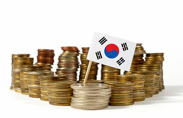 istock South Korea flag waving with stack of money coins 637717666