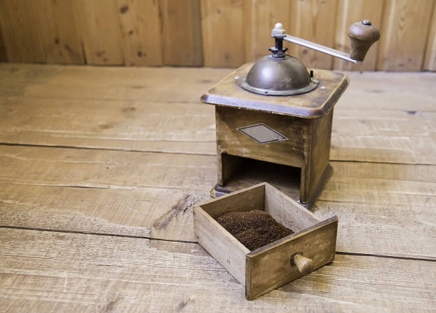 istock Vintage manual coffee grinder standing on a wooden surface 637718842