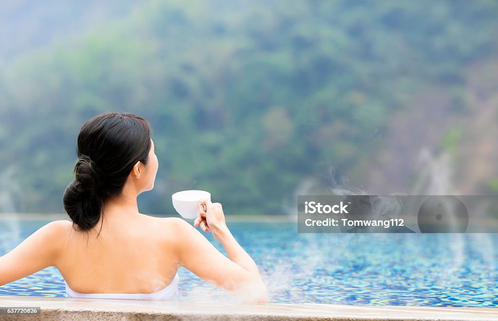 young woman relaxing in  hot springs Heat - Temperature Stock Photo