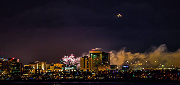 Fireworks over Anchorage, Alaska A New Years Eve fireworks display over downtown Anchorage, Alaska. anchorage alaska photos stock pictures, royalty-free photos & images