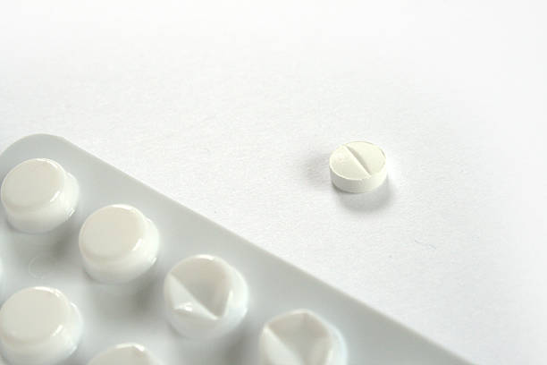 istock Blister and one white pill on white background 637722666