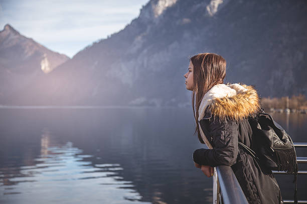 istock GIrl leans on edge  and looking at a distance 637724890