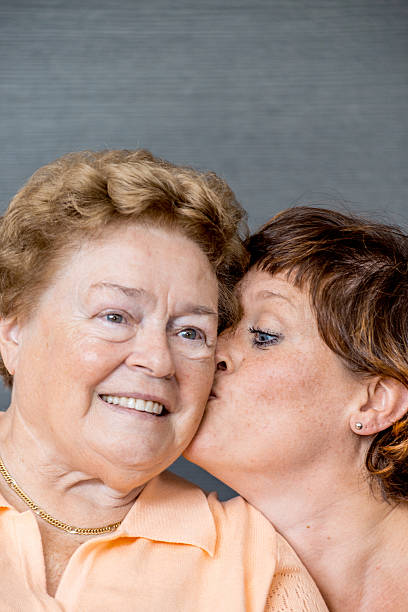 istock Senior and Caregiver Portrait in an Elderly Daycare Cente 637726654