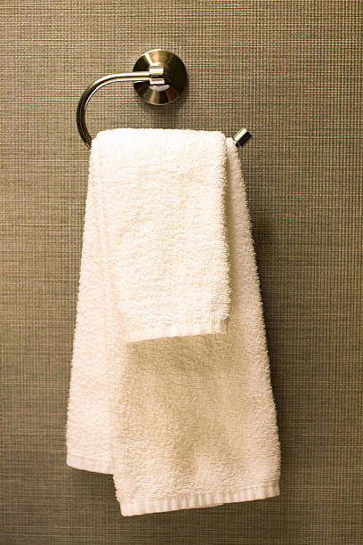 istock White Hotel Towels Hanging, Brown Background 637727222