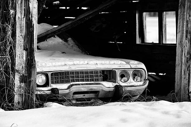istock Vintage car in crumbling shed 637728610