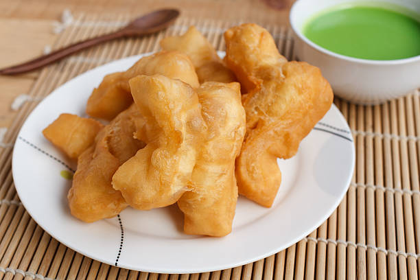 istock Chinese bread stick and pandan coconut custard dip 637730164