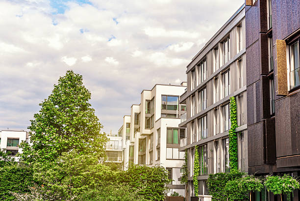 istock modern cubic residential architecture in berlin with green trees 637739174