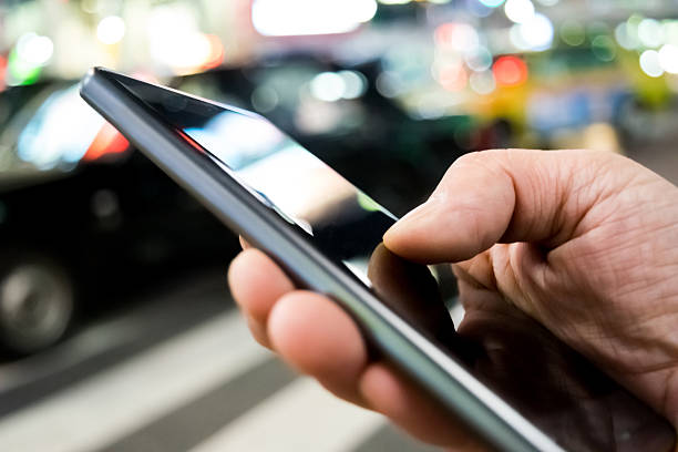 istock Use the smartphone in the city at night 637739702