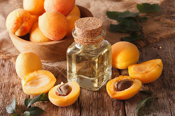 istock apricot kernel oil in a glass jar closeup and ingredients 637740406