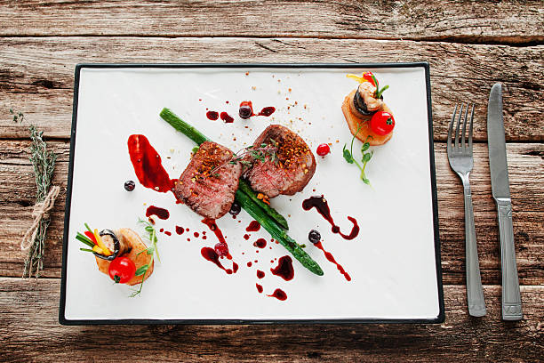 istock Portion of veal medallions and vegetables flat lay 637740496
