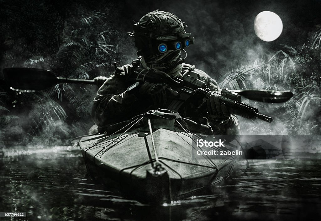 special forces operators with night vision goggles Two special forces operators with night vision goggles paddling in the army kayak in the jungle. Cloudy night, full moon, damp Special Forces Stock Photo