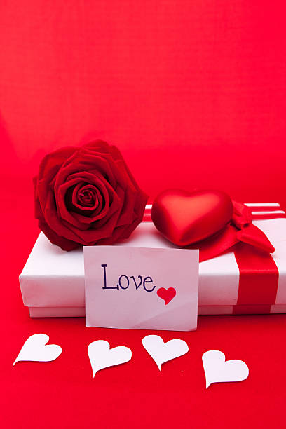 istock Valentines gift box with a red bow on red background 637744898