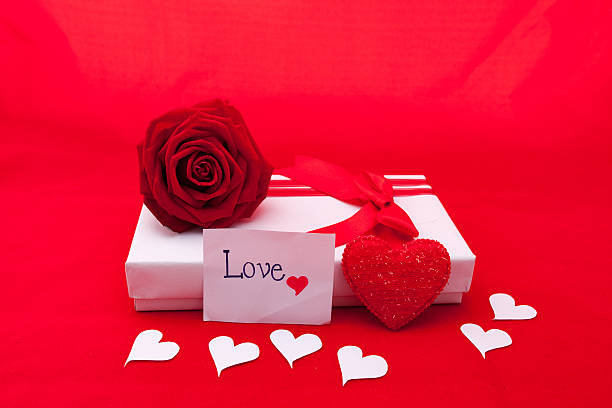 istock Valentines gift box with a red bow on red background 637744958