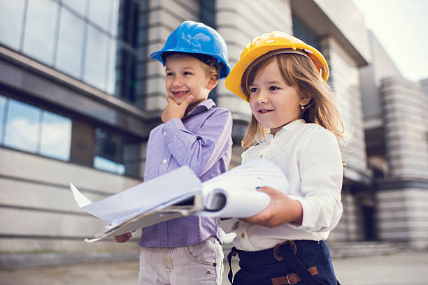 istock Small building contractors with a business plan outdoors. 637745422
