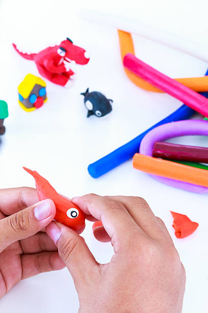 istock Child molding modeling clay, on white background. Strengthen the 637747830