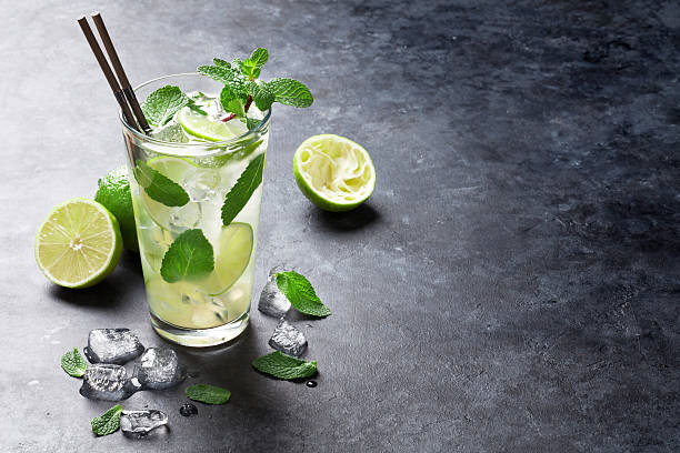 mojito cocktail  - drinking straw juice frozen glass stock-fotos und bilder