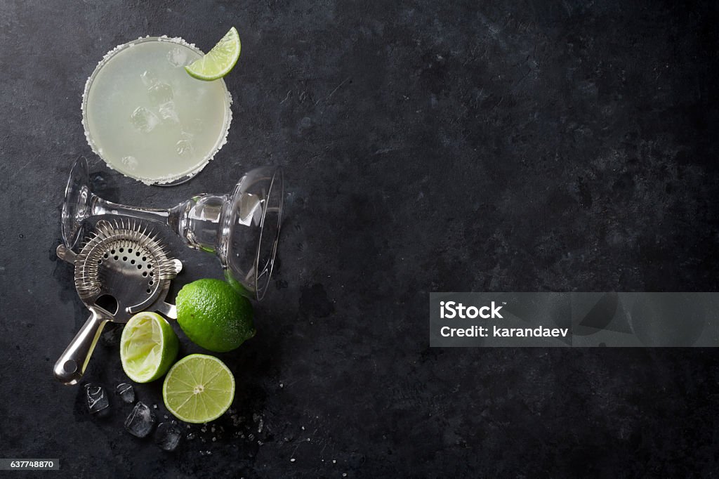 Margarita cocktail Margarita cocktail on dark stone table. Top view with space for your text Margarita Stock Photo