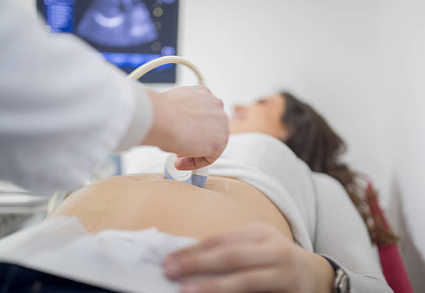 istock Pregnant woman having ultrasound 637748882
