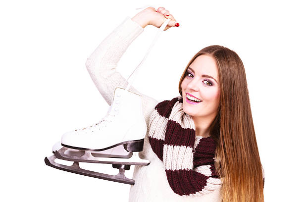 istock Smiling woman with ice skates 637749712